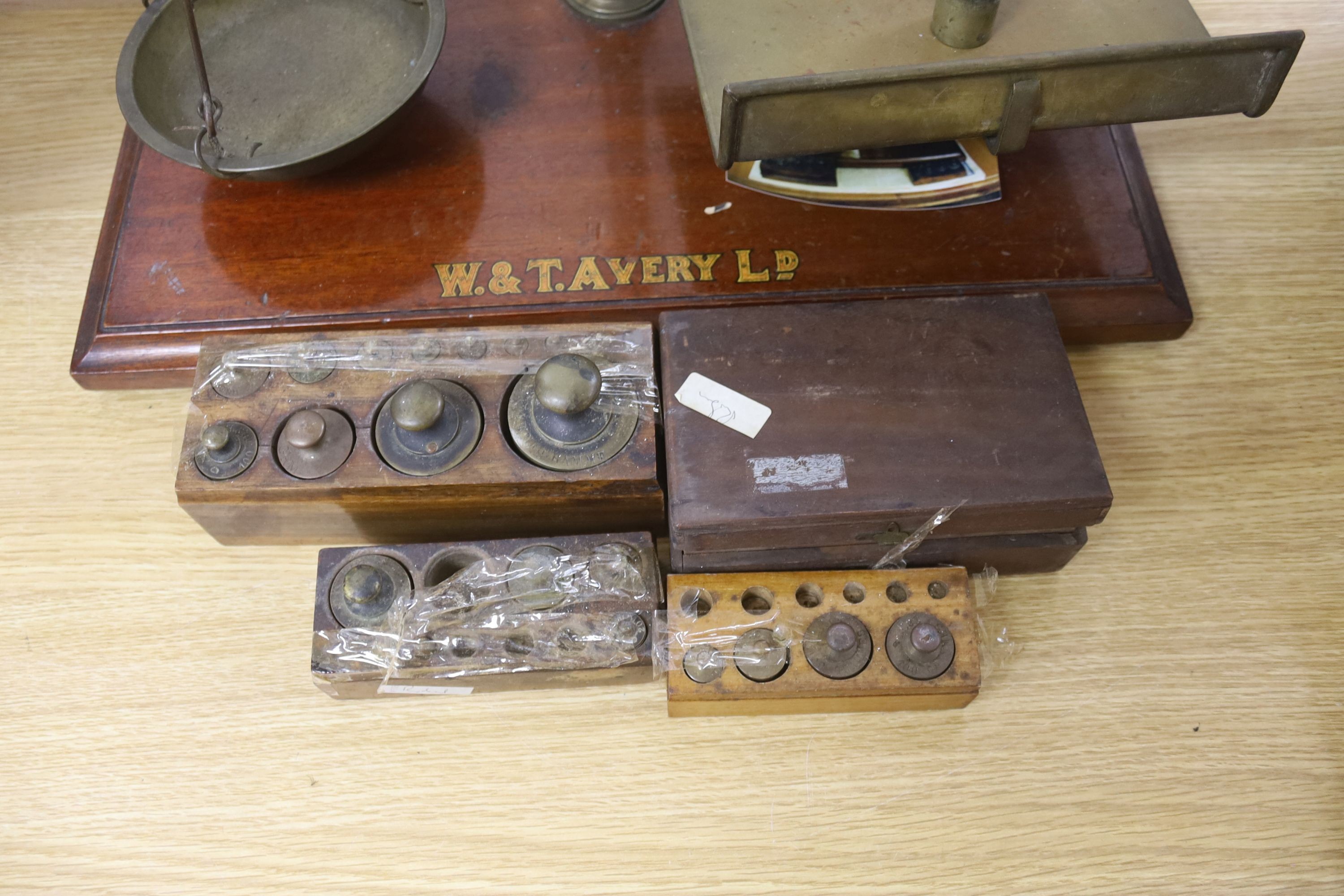 A large W.&T.Avery brass beam scales with weights, 59cm